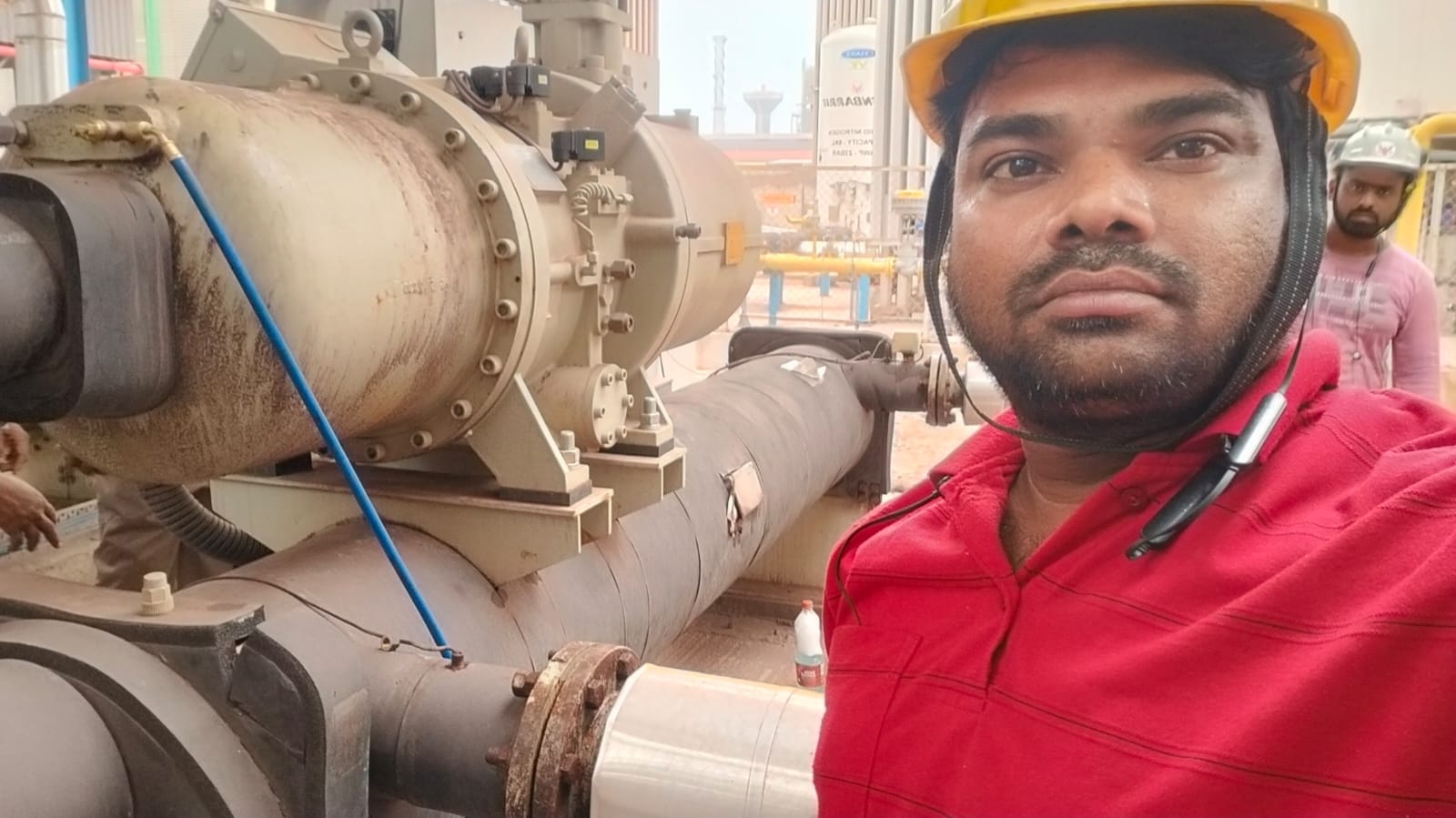 Star Tech Cooling engineer alongside a large industrial screw compressor during site commissioning